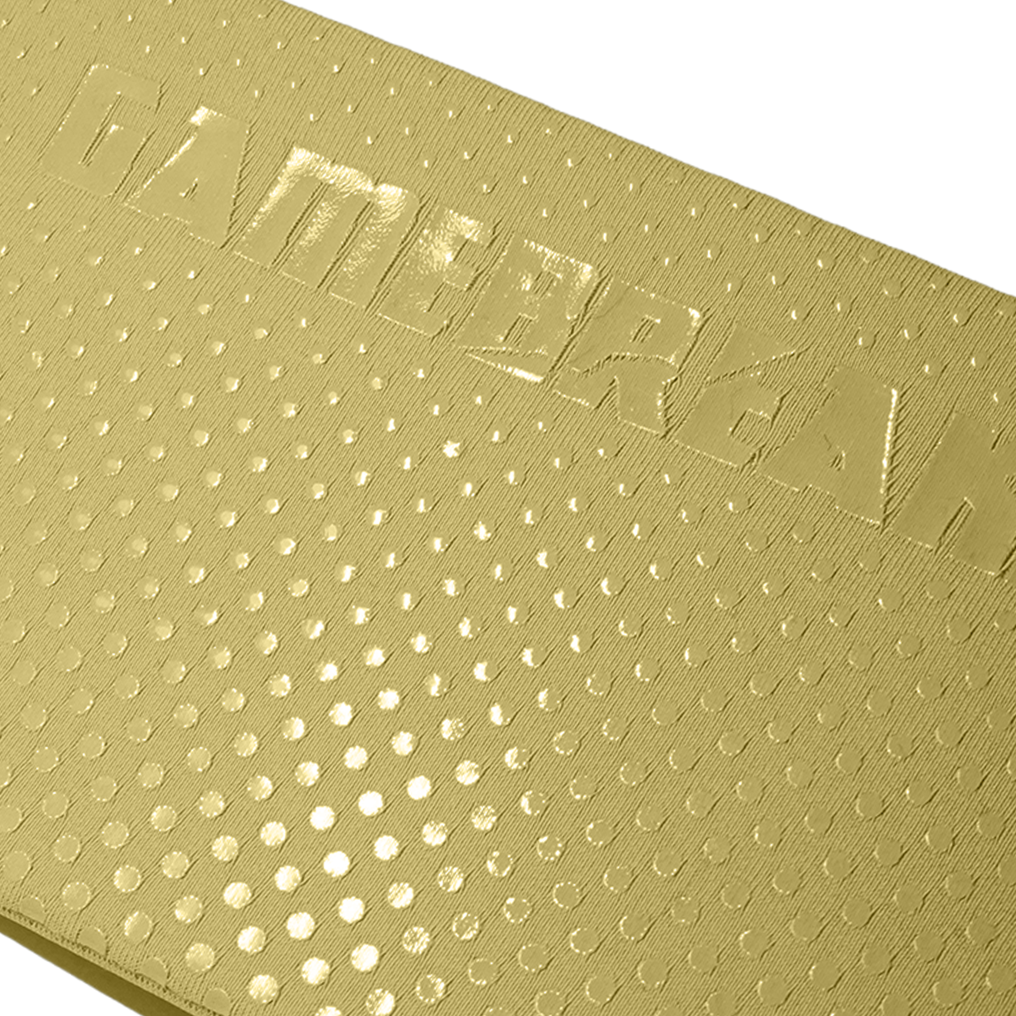 Close-up of a metallic gold textured surface with a repeating circular dot pattern and embossed lettering across the top.