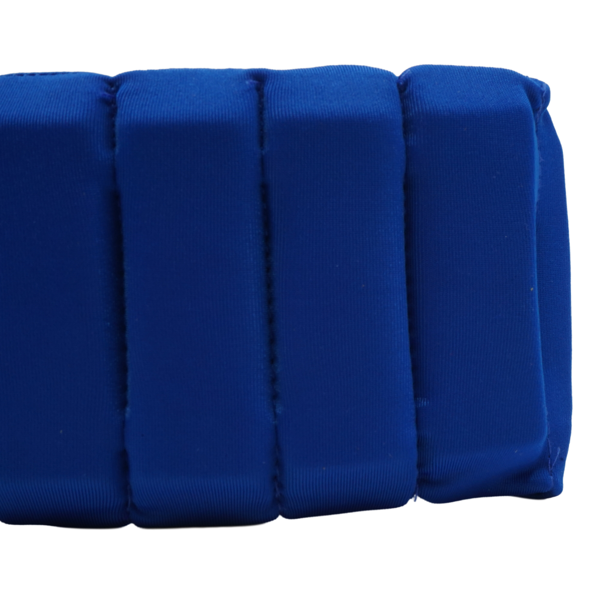 A close-up of a royal blue padded cushion with vertical channel stitching, shown against a plain white background.