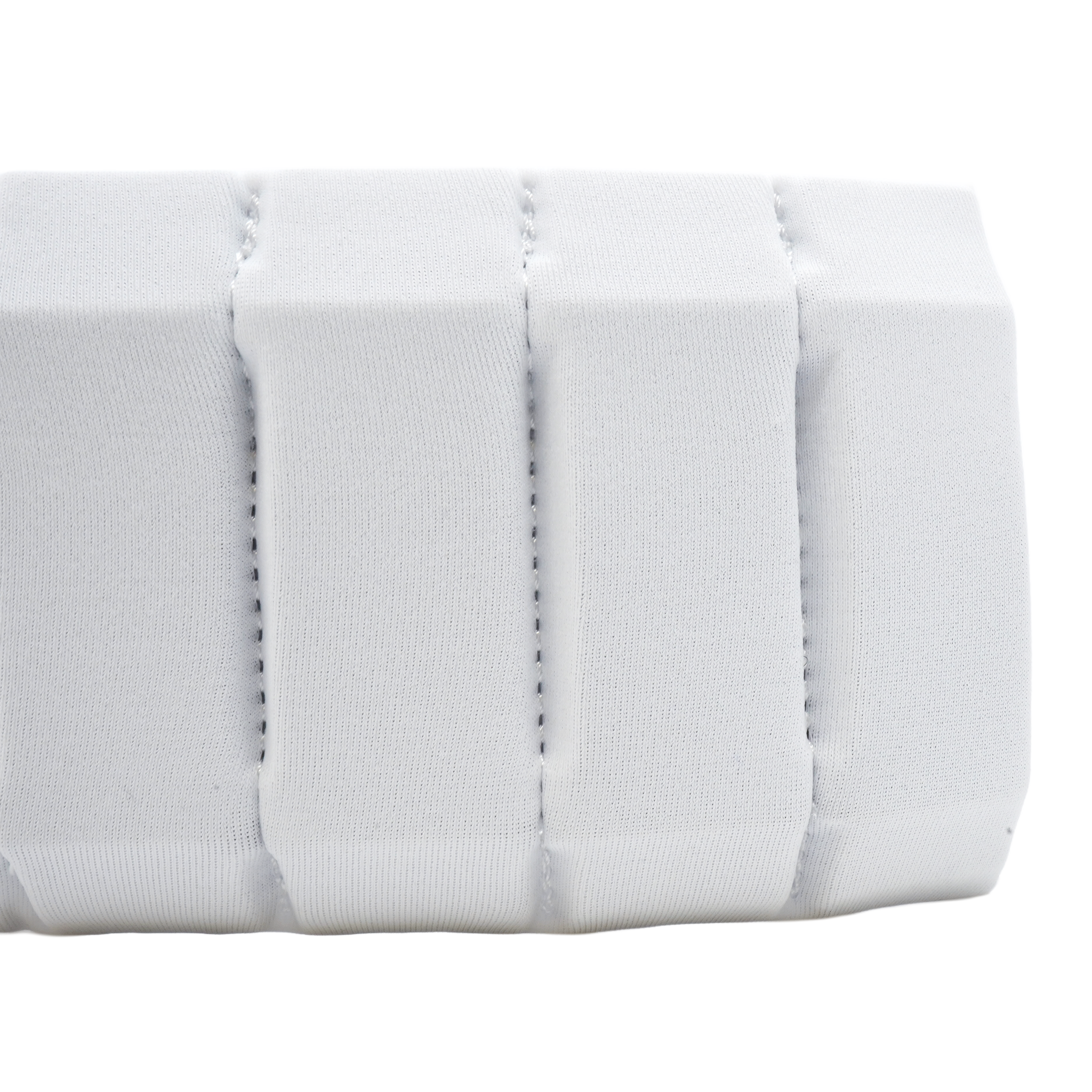 A close-up of a white aura with stitched vertical channels, shown against a plain white background.