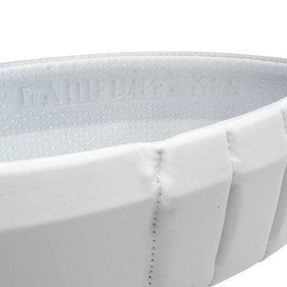 Close-up of a white aura headband with stitched pleats and a textured interior lining showing the brand name 'GAMEBREAKER'.