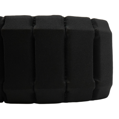 Close-up of a black padded segmented strap or band with stitched vertical sections on a plain white background.