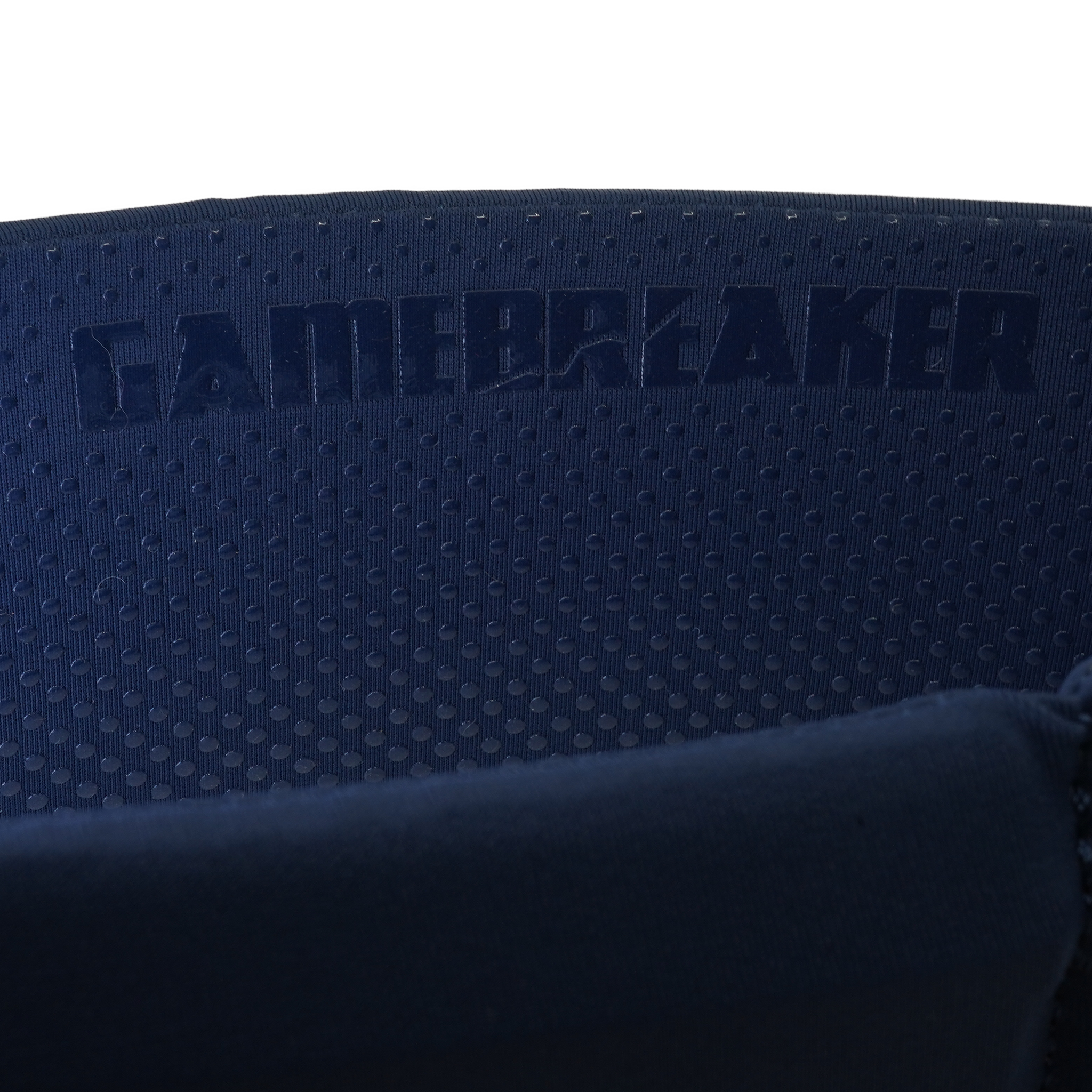 Close-up of a dark navy blue headband with a perforated texture and the embossed brand name GAMEBREAKER.