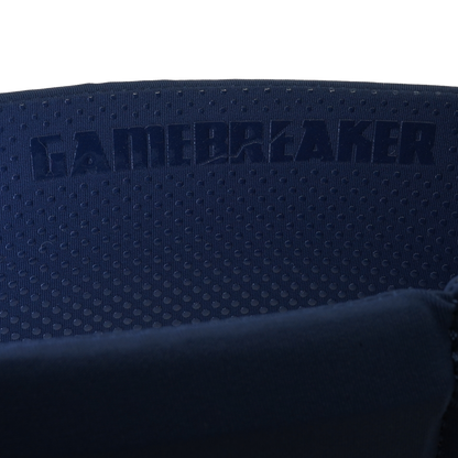 Close-up of a dark navy blue headband with a perforated texture and the embossed brand name GAMEBREAKER.