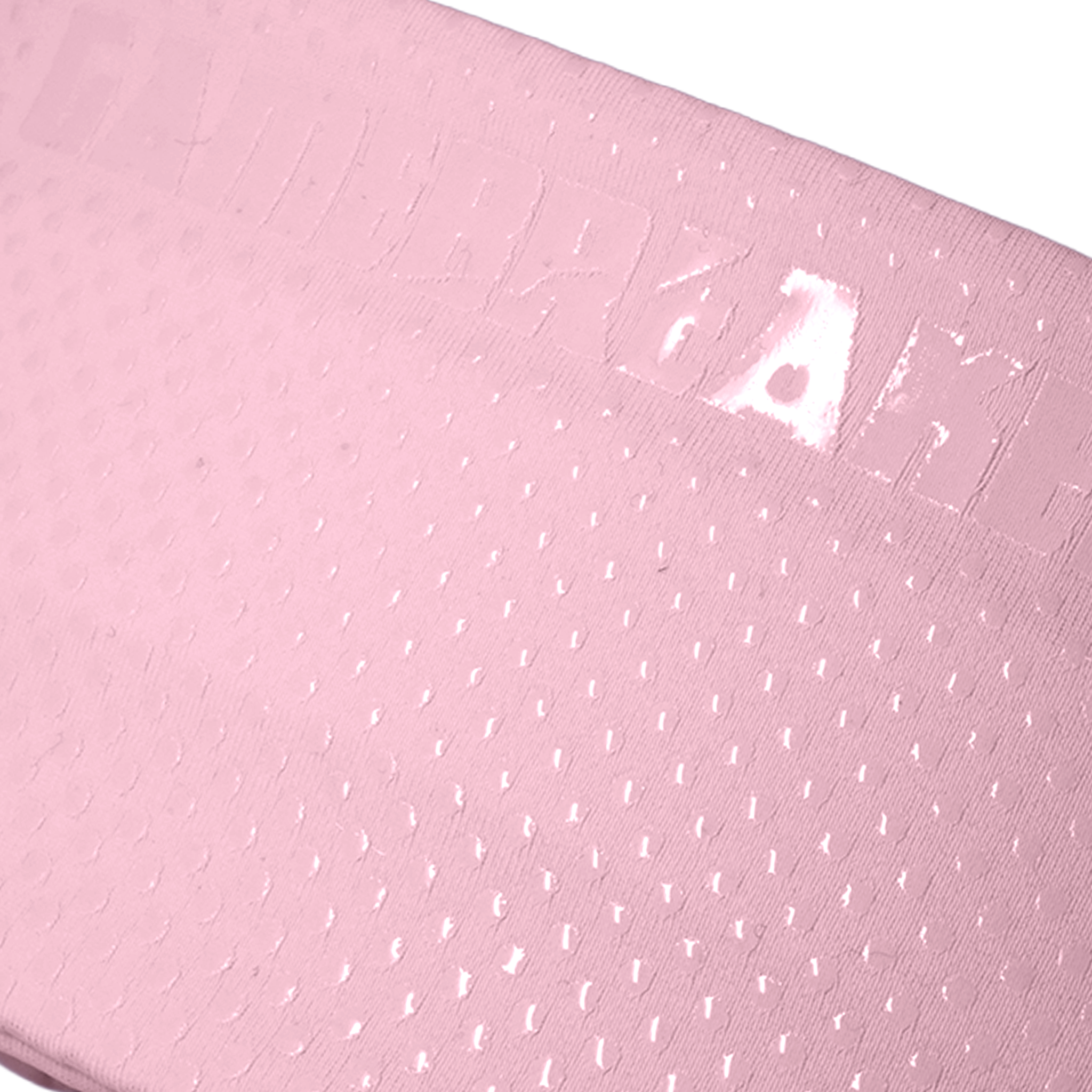 A close-up of a light pink textured material with a subtle embossed pattern and small reflective highlights, shown against a white background.