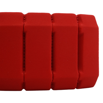 A close-up of a bright red padded fabric strap or band with stitched vertical channels, shown against a plain white background.