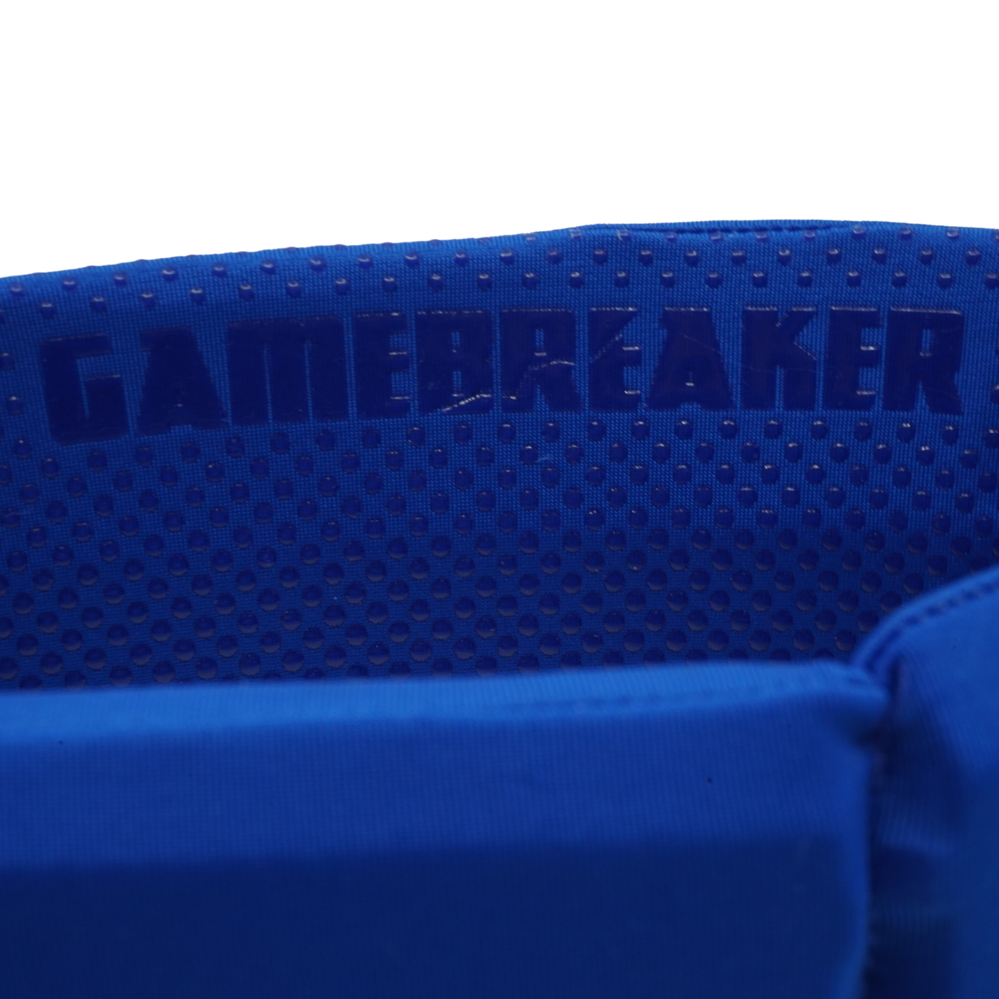 Close-up of a bright blue headband with the word 'GAMEBREAKER' in matching blue lettering, against a white background.