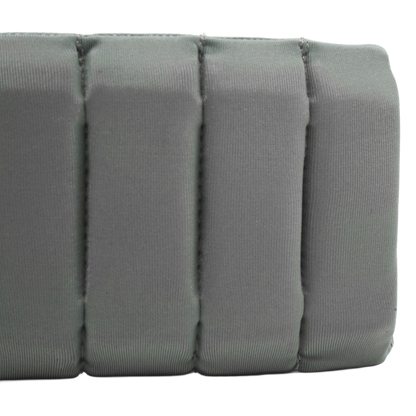 A close-up of a gray padded fabric item with vertical stitched sections, shown against a plain white background.