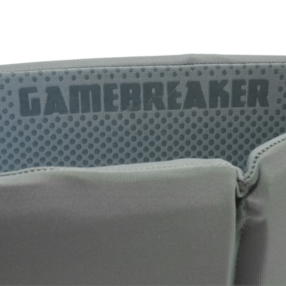Close-up of a gray headband with a textured mesh panel and the word GAMEBREAKER printed across it.