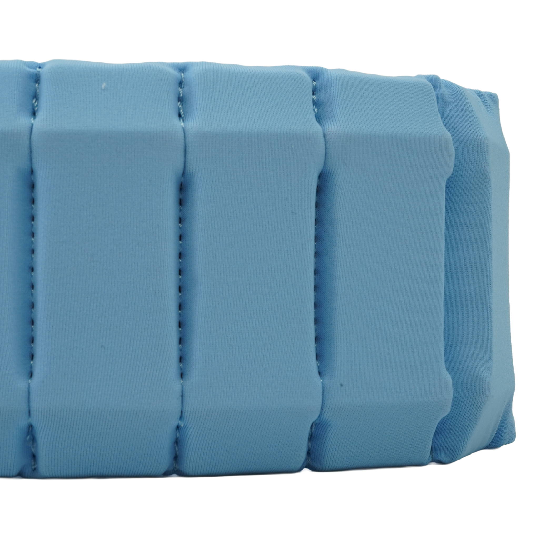 A close-up of a light blue padded fabric strap or band with stitched vertical channels, shown against a plain white background.