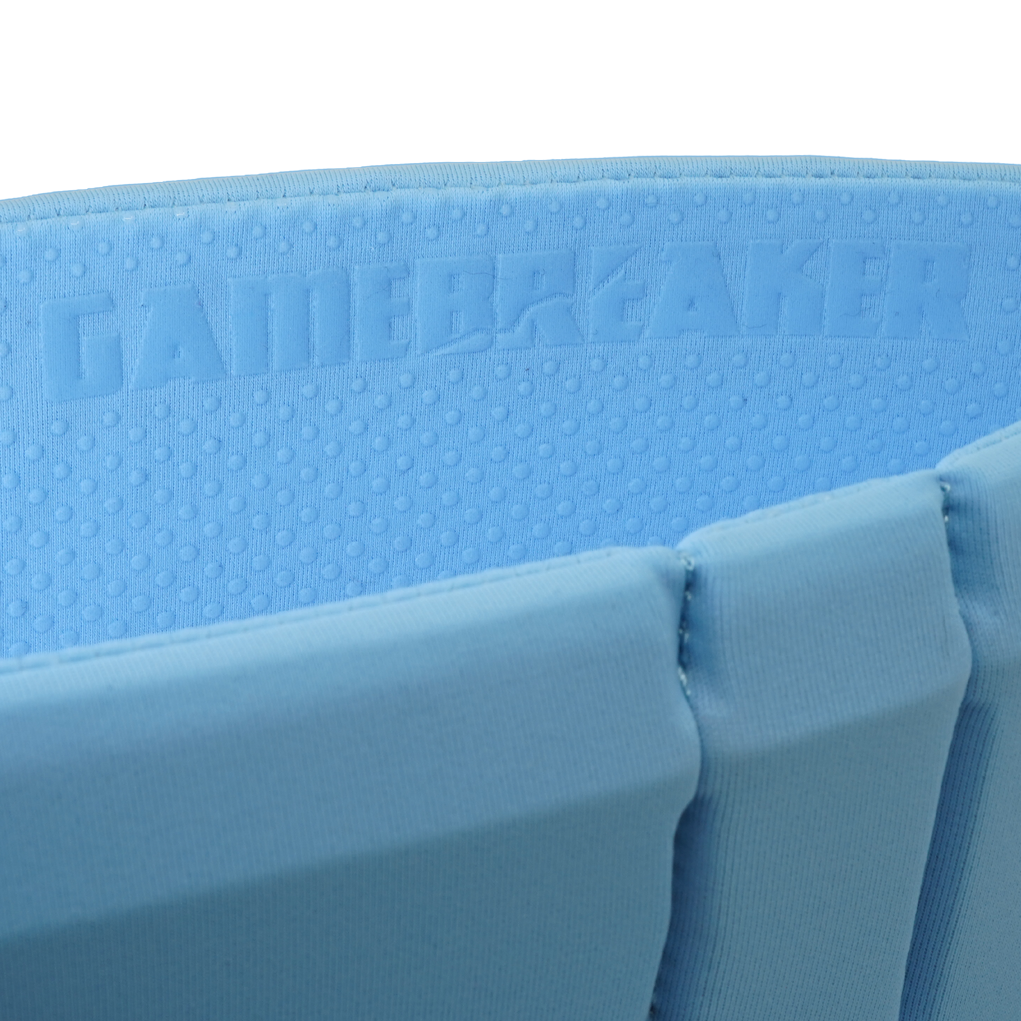 Close-up of a light blue headband with the brand name GAMEBREAKER embossed on the foam.